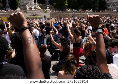 Rome - June 22, 2020: against racism and the killing of Geoge Floyd. The participants remained on their knees and with a high fist for 8'46 '' the time that the Minneapolis policeman kept Floyd stuck