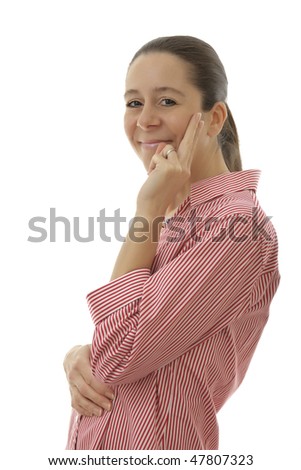 Smiling attractive business woman with a red shirt holding fingers on the side of her face on a white background