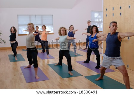 Yoga instructor and students