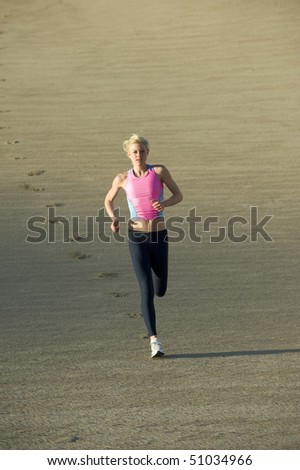 Woman runner on sand dunes