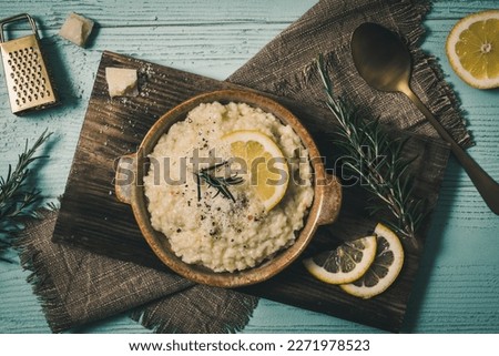 Rosemary on risotto with rabbit and mushrooms