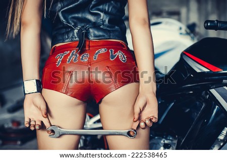 Part of the Biker girl in a leather Shorts.