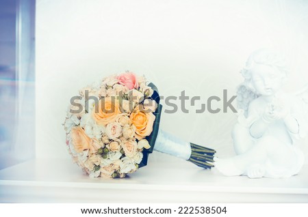 wedding bridal bouquet with white, peach and orange roses