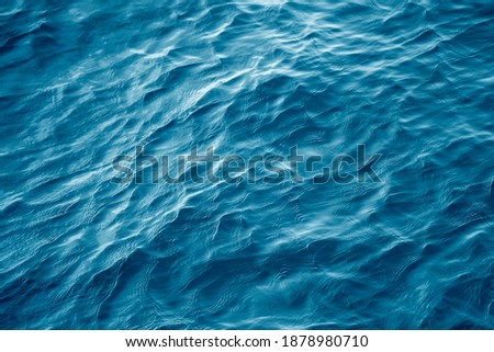 Similar – Foto Bild Türkis blaues Wasser mit Felsen arm im Vordergrund