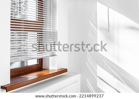 Image, Stock Photo Windows with modern shutters creating light and shadows at the afternoon light