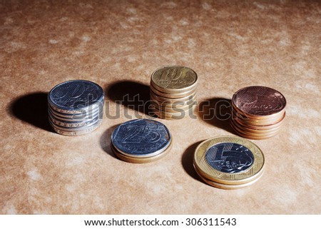 Top view of brazillian coins, real and cents. Business and money saving concept.