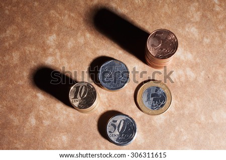 Top view of brazillian coins, real and cents. Business and money saving concept.