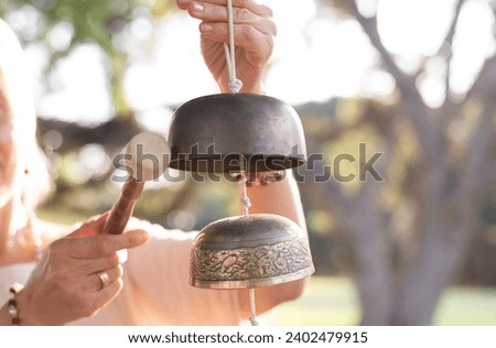 Similar – Image, Stock Photo Copper bells, different sizes on a wooden stick