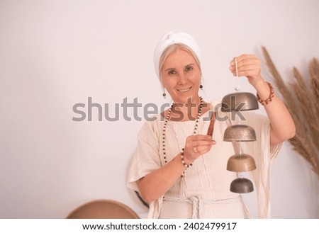 Similar – Image, Stock Photo Copper bells, different sizes on a wooden stick