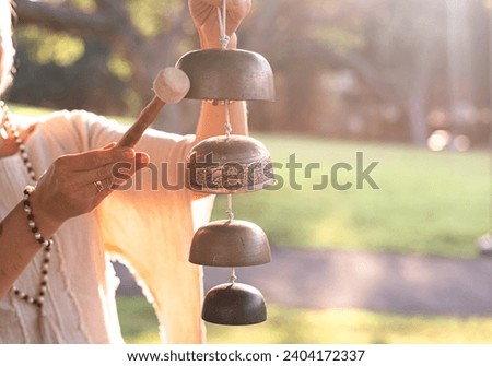 Similar – Image, Stock Photo Copper bells, different sizes on a wooden stick