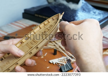 Similar – Boats on small part of seashore washing by foamy waves