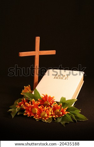 wooden cross, white bible, autumn flowers with room for copy