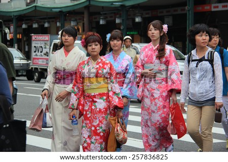 Kyoto, Japan - May 27, 2013: Unidentified Japanese women wear Kimono, beautiful Japanese traditional garment, walking in Gion area, Kyoto, Japan.