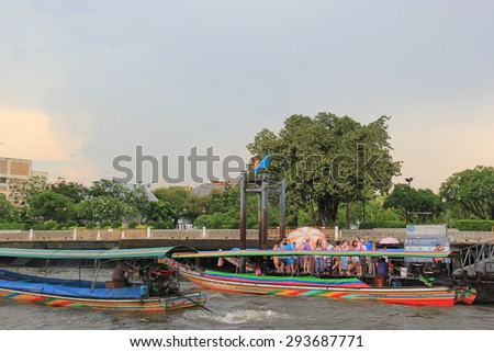 Bangkok, Thailand - May 8, 2015: Passengers are waiting for a river ferry to cross Chao Phraya River at a pontoon in Bangkok, Thailand.