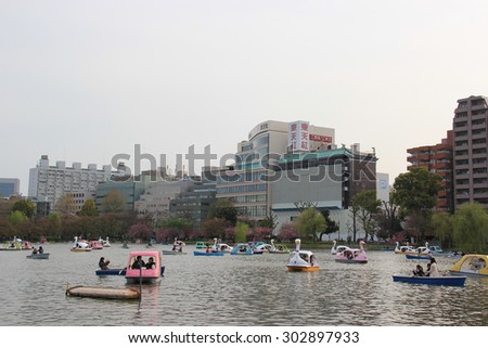 Tokyo, Japan - April 12, 2015: People are having a good time with nautical activities at Boat Pond, one of 3 sections of Shinobazu Pond in Ueno Park, Tokyo, Japan.