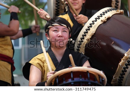 Los Angeles, California, USA - August 16, 2015: Japaneses are performing Japanese percussion instruments at Nisei Week Japanese Festival in Little Tokyo, Los Angeles.