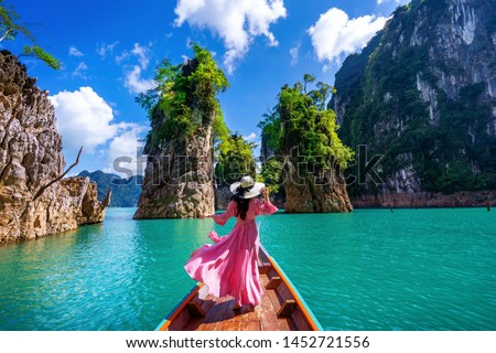 Similar – Image, Stock Photo Woman with boat standing in river