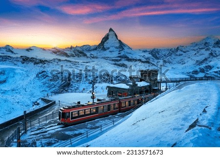 Similar – Foto Bild Ein schneeweisser ICE Zug mit einem dicken roten Streifen verlässt gerade München Hauptbahnhof. In seinen Fenstern spiegelt sich die Bahnhofshalle mit Neonleuchten, das graue Pflaster des Bahnsteigs zeigt einen weißen Streifen