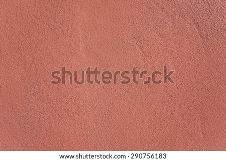Red concrete wall background and texture.