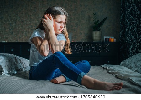 Similar – Image, Stock Photo Sad girl portrait clinging to a gate