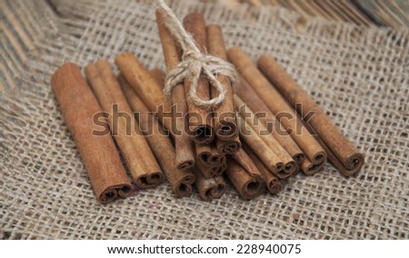 Spices set.Cinnamon stick on a wooden background