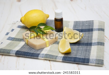 Lemon handmade soap with essential oils and lemon on a white background