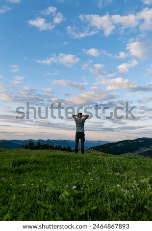 Similar – Image, Stock Photo Man admiring mountain landscape from wooden footbridge