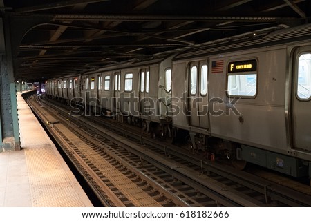 New York City subway train going through the station. F train to Coney Island.  Standing on platform of New York underground train station.  New York public transportation late at night. Stock fotó © 