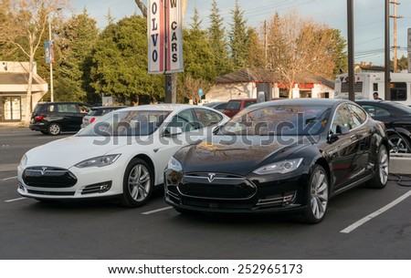PALO ALTO, CA/USA - FEBRUARY 15: Row of New Tesla Model S cars on display on Feb 15, 2015 in Palo Alto, CA. Tesla is an American company that designs, manufactures, and sells electric cars.