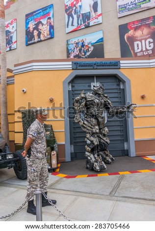 LOS ANGELES, CA/USA - MAY 24: Megatron of Transformers movie is welcoming tourists in front of the Transformers Ride at Universal studios hollywood on May 24, 2015 in Los Angeles, CA, USA.