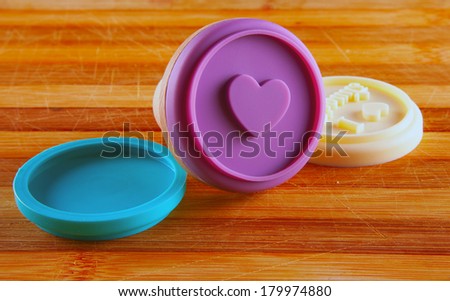 Pink heart stamp for food over wooden background