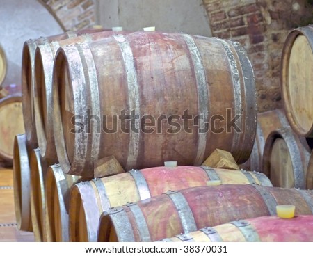 View of wooden barrels of wine in a cellar
