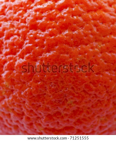 Strict closeup of skin of an orange, for background