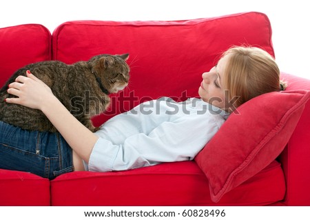 lying on red sofa young woman with  cat
