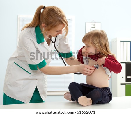 Female Doctor Pediatrician Examining Little Girl By Stethoscope Stock ...