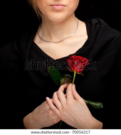 lovely long hair woman in black blouse with one red roses