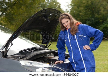 woman car mechanic repairs engine damaged car, trouble with the car engine in the road, series