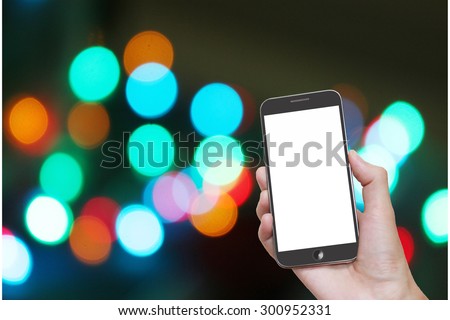 Man hand holding smart phone with isolated white screen,background of abstract bokeh light at night