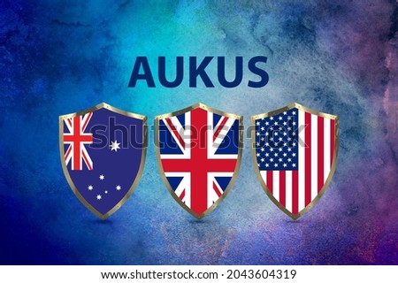 AUSUK is UK, US, and Australia launch pact to counter China· The UK, US, and Australia have announced a historic security pact in the Asia-Pacific. Shield concept for this three-nation agreement.
