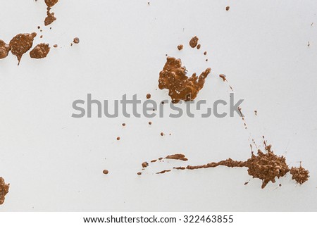 Wet Mud Splash. Red Soil isolated on White Background. Top View of a Clay Texture. Close Up Macro View