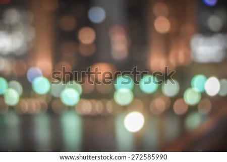 Blurred abstract background of Tokyo riverfront cityscape with water reflections and colourful bokeh
