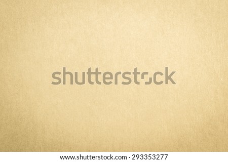 Recycled craft paper textured background in light yellow brown color tone: Detailed texture of recycled kraft paper fiber in pastel toned style