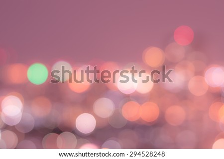 Blurred abstract background of colorful bokeh night lights of city aerial view of Bangkok in sweet red pink warm color tone