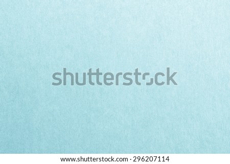 Recycled craft paper textured background in light cyan blue color tone: Detailed texture of recycled kraft paper fiber in pastel colour toned style
