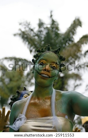 KOUROU, FRENCH GUIANA - FEBRUARY 15: A young parade-goer participates in French Guiana\'s Annual Carnival February 15, 2009 in Kourou, French Guiana. Almost 60 groups participated this year.