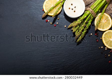 Asparagus on a dark surface. Food background