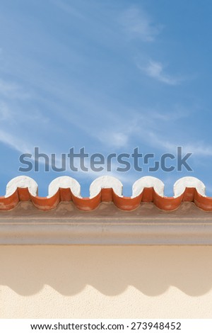External wall of villa with roof eaves  & clay pantiles