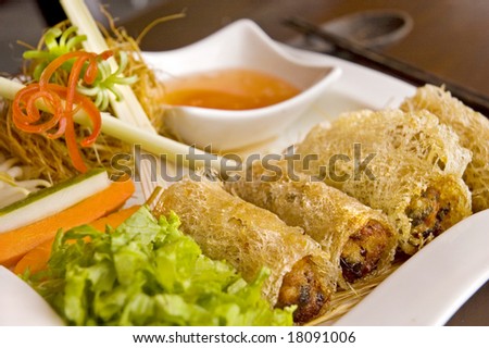 Crispy deep-fried Vietnamese seafood rolls served with chili sauce