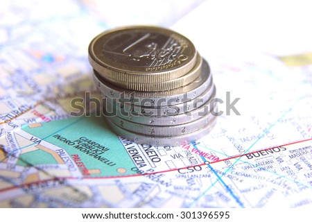 Euro coins on italian map