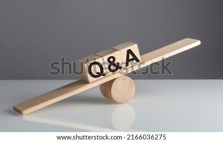 Q and A on wooden cubes on a wooden balance , business concept Stock foto © 